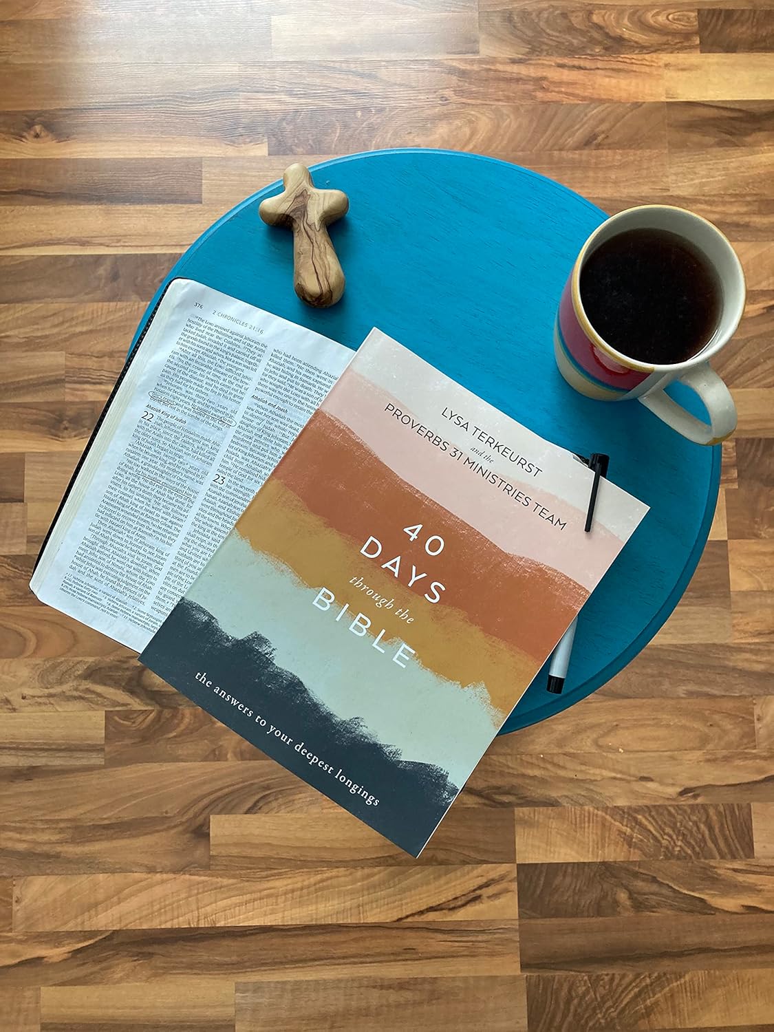 Book placed on a chair with coffee at the side
