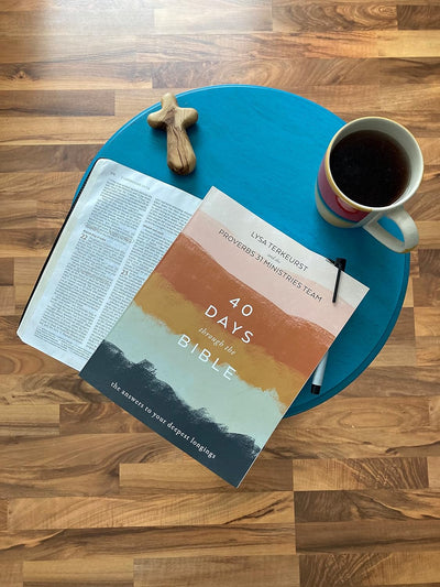 Book placed on a chair with coffee at the side