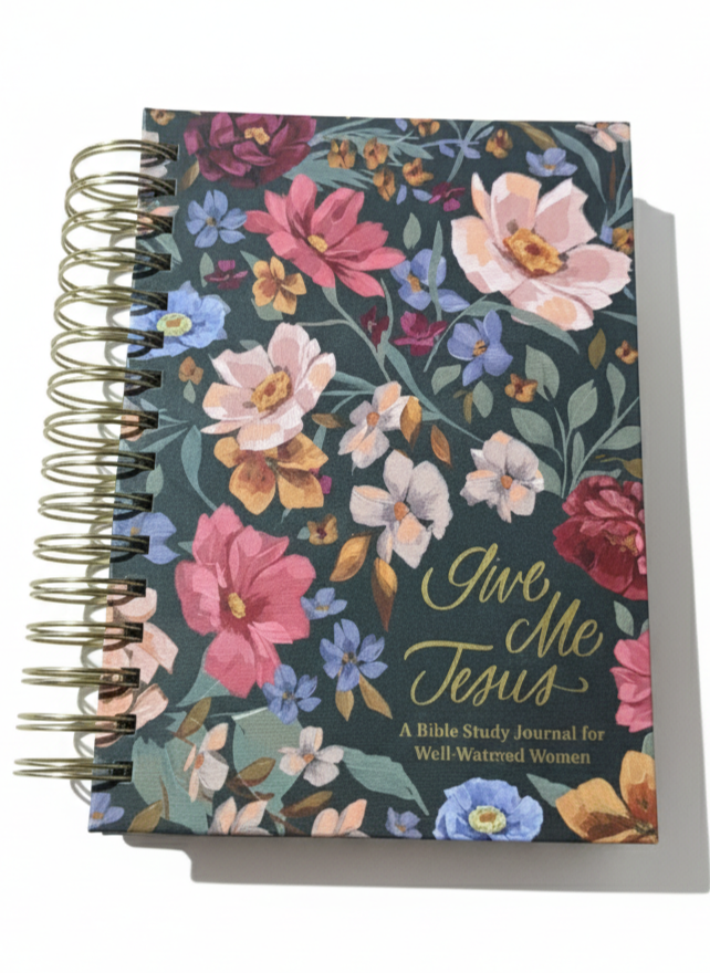 Notebook with floral design and 'Give Me Jesus' text on a white background