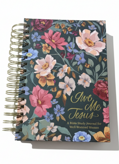 Notebook with floral design and 'Give Me Jesus' text on a white background