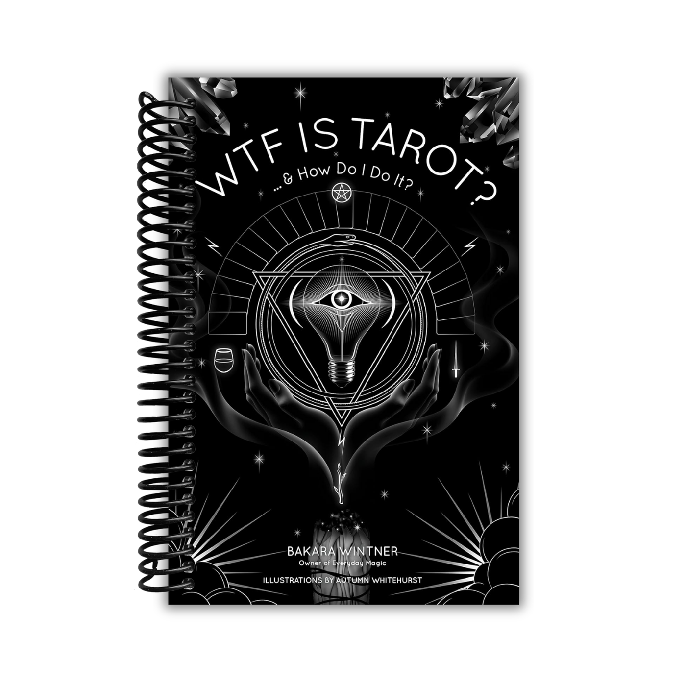 Spiral-bound book titled 'WTF IS TAROT? & How Do I Do It?' with black and white design on a white background
