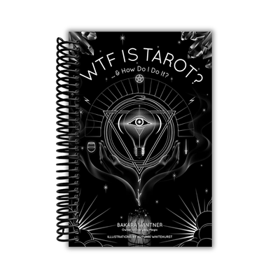 Spiral-bound book titled 'WTF IS TAROT? & How Do I Do It?' with black and white design on a white background